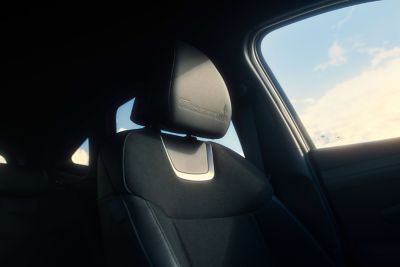 Front headrest with 20th anniversary logo in the Hyundai TUCSON 20th Anniversary Edition.
